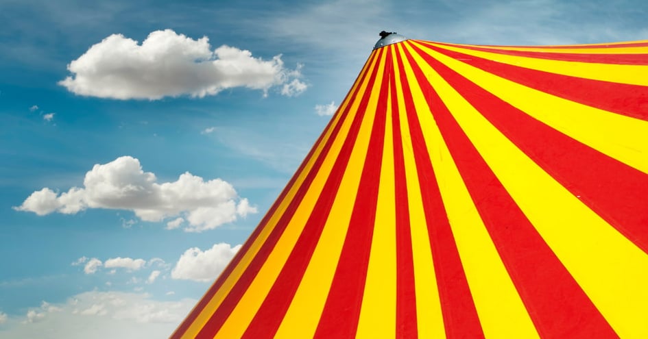 red and yellow big top circus in hailsham with blue sky in background